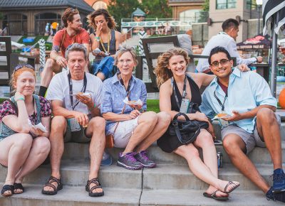 (L–R) Hannah Martineau, Phil, Deborah Byrns, Liz Kiger and Antonio Paramo have to take a seat on the steps of The Gateway’s fountain to help the unending supply of food settle. Photo: Talyn Sherer