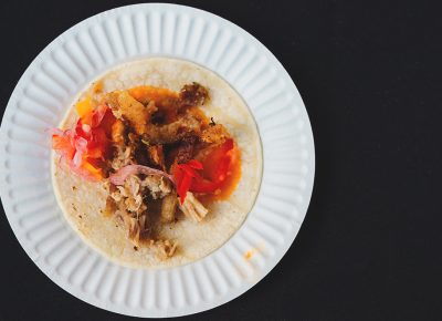 Frida Bistro’s roasted pork belly taco with roasted tomatillo salsa, pickled red onions and micro greens. Photo: Talyn Sherer