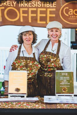 (L–R) Bobbie Wolbach gets a photo with her longtime friend and Cache Toffee Collection owner Lori Darr. Photo: Talyn Sherer