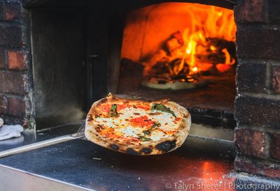 Fire & Slice Wood Pizza had me practically diving into their wood-burning oven to taste a piece of their margherita pizza topped with rosemary olive oil. Photo: Talyn Sherer