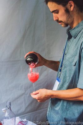 Takashi shows us their cocktail game with the “Smile Jamaica,” featuring Kirk and Sweeney 18-year rum, Campari and hibiscus tea. Photo: Talyn Sherer