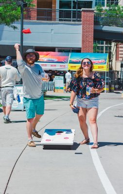 Couldn't imagine a better way to enjoy the nice summer weather than an ice-cold glass of draft beer and a game of cornhole. Photo: Talyn Sherer