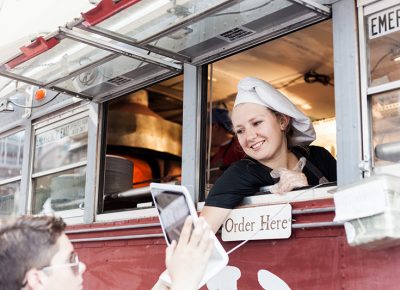 Susie of Pompeii Pizza takes an order with a smile. Photo: Chris Gariety