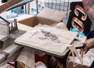 Awesome, live bag screen-printing done by Copper Palate Press. Photo: Chris Gariety