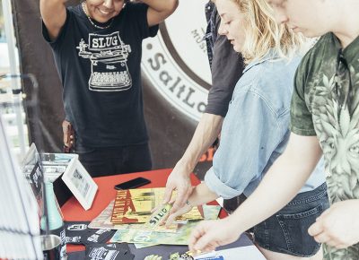 SLUG booth visitors checking out all the sweet new merch. Photo: @william.h.cannon