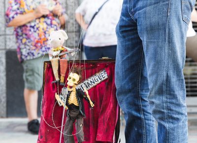 A marionette artist pulls in crowds of people for his show. LmSorenson.net