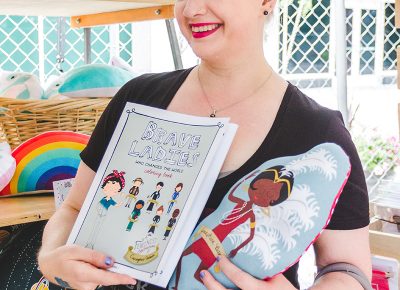 Harnessing her inner Rosie, festival-goer Shannon Charlson shows off her Brave Ladies purchases that feature revolutionary women throughout time. Photo: @taylnshererphoto