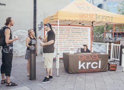 Visitors of the 90.9FM KRCL booth discuss music. Photo: @william.h.cannon