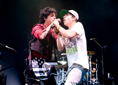 A young fan is given the mic and sings along with Green Day. Photo: Lmsorenson.net
