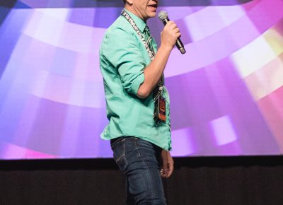 Host Chris Provost showing off his socks for the day, per Salt Lake Comic Con tradition. Photo: Lmsorenson.net
