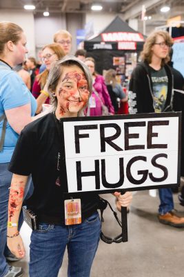 Hy Like with her Free Hugs sign and super non-threatening zombie cosplay. Photo: Lmsorenson.net