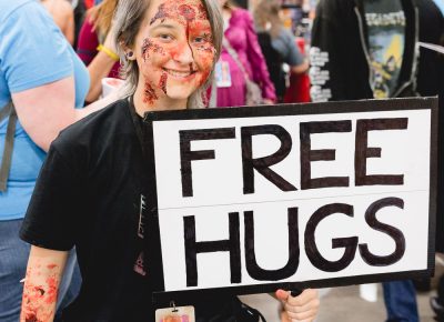 Hy Like with her Free Hugs sign and super non-threatening zombie cosplay. Photo: Lmsorenson.net