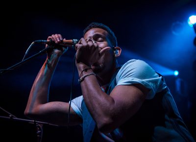 NoMBe bathed in blue stage light. Photo: ColtonMarsalaPhotography.com