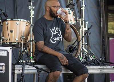 POS finishes a beer before his set. Photo: ColtonMarsalaPhotography.com