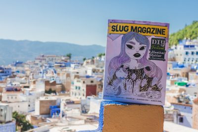 On the rooftop of the Aladdin restaurant in Chefchaouen, Morocco, SLUG Magazine overlooks the medina below. Photo: Talyn Sherer