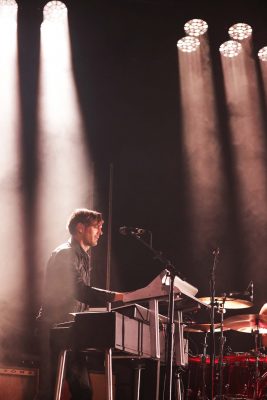 Guitarist and keyboardist Dean Fertita basking in the spotlight in the rear of the stage. Photo: Lmsorenson.net