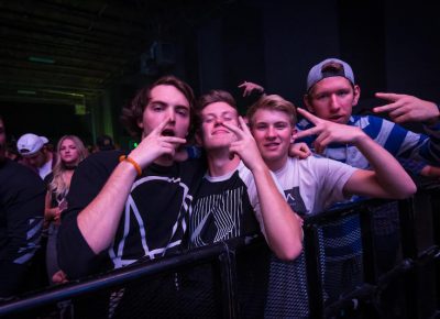 A group of friends hold down a spot in the front row. Photo: ColtonMarsalaPhotography.com