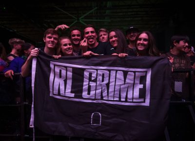 Lucky fans show off their autographed flag. Photo: ColtonMarsalaPhotography.com