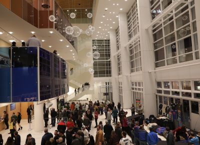 The open-faced glass wall to downtown Salt Lake City and the many lines of attendees heading to their seats at the Eccles Theater. Photo: Lmsorenson.net