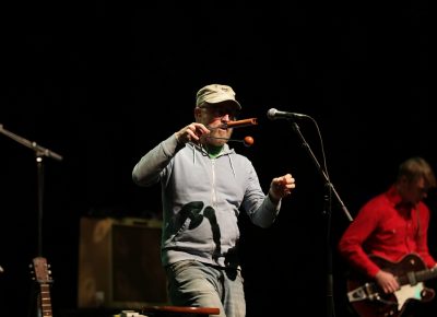 John McCrea plays the vibraslap, a signature instrument for CAKE's sound. Photo: Lmsorenson.net