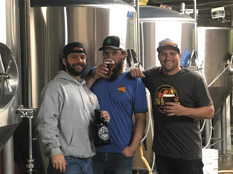 (L–R) Zion Brewery Assistant Brewer Jay Mecham, Head Brewer Jeremy Baxter and Sales and Distribution Manager Frank Giammalva have stewarded the brewery’s successful rebranding. Photo courtesy of Zion Brewery