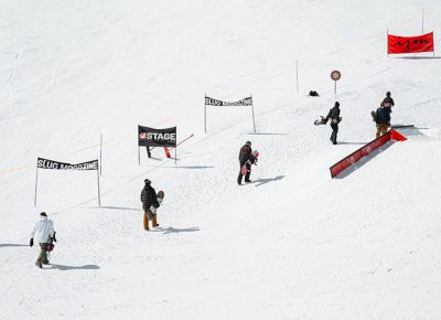 Riders making the hike to the top of the course. Photo: Matthew Hunter