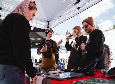 Riders and attendees checking out some SLUG swag. Photo: Matthew Hunter
