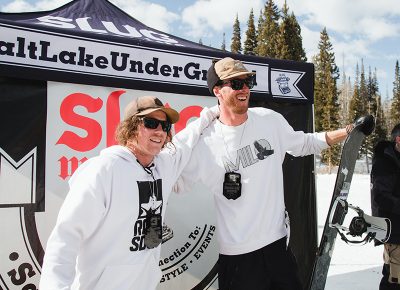 (L–R) Jeff Hopkins (Third) and Treyson Allen (Second) claiming medals in the Men's Open Snowboard Division. Pat Fava, not pictured, won First in the Men's Open Snow division. Photo: Matthew Hunter