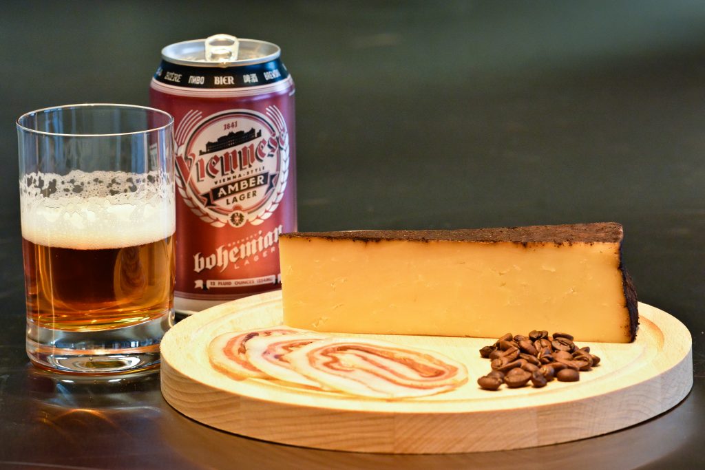 A pairing of contrast - locally produced by Beehive Cheese, espresso/lavender rubbed Barely Buzzed is partnered with the Viennese Amber Lager from Bohemian Brewery. This pairing shows the classic pairing of malts with a sweeter cheese.