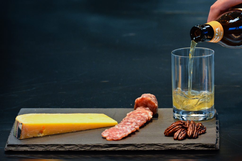 Imported Dutch 18-month-aged Beemster, paired with Uinta Golden Spike Hefeweizen. The pairing capitalizes on the grain of the beer and caramel note in the cheese, creating a caramel-and-toast combination.