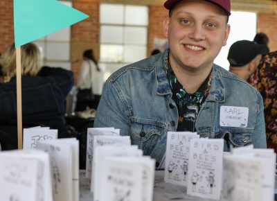 Karl Liechty’s Matchbook Press focuses on Yetis and tiny zines. His green flag marks his table as a kid-friendly destination.