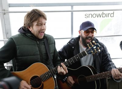 Andy Ross and Tim Nordwind playing and singing along as the tram climbs the mountains. Photo: Lmsorenson.net