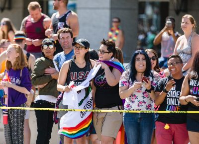 Parade attendees hold the California flag as a show of support for SLC Pride. Photo: Logan Sorenson | Lmsorenson.net