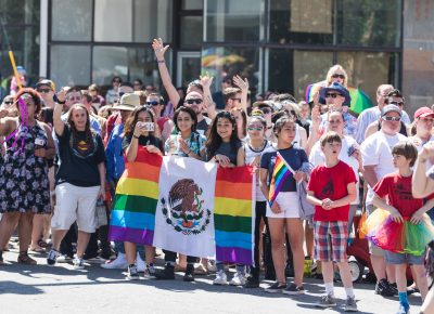 A group of younsters hold up a flag in support of SLC Pride. Photo: Logan Sorenson | Lmsorenson.net