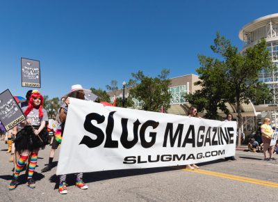 SLUG Magazine crew carry the banner throughout the whole parade as a show of love and support for SLC Pride. Photo: Logan Sorenson | Lmsorenson.net