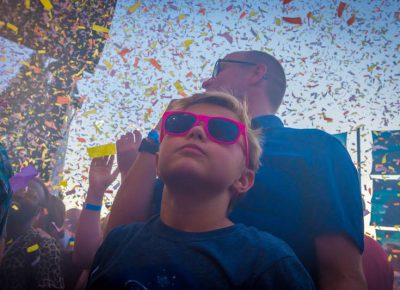 A young boy plays it cool as the confetti falls. Photo: ColtonMarsalaPhotography.com