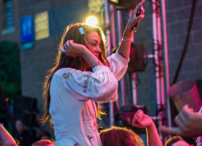 Dancing under the colorful stage light. Photo: ColtonMarsalaPhotography.com