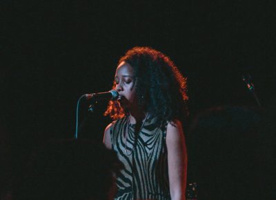 Multi-instrumentalist and vocalist Felicia Douglas on vocals, auxiliary percussion, and keyboard. Photo: Matthew Hunter