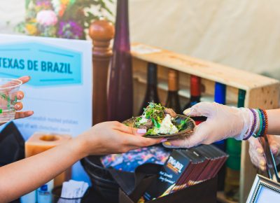 An exchange of goods takes place at Texas De Brazil. Photo: Talyn Sherer