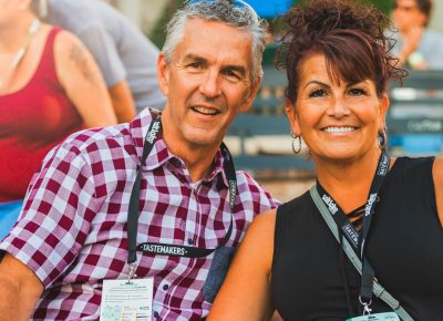 (L–R) Dan and Kelli True take a seat and enjoy the summer sun basking over the Tastemakers event. Photo: Talyn Sherer