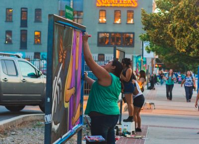 On the way to Squatters we get to enjoy the amazing artists at work who keep our city streets alive with color. Photo: Talyn Sherer