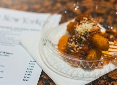The New Yorker hands out some calamari fries with a tomato, olive and parmesan sauce. Photo: Talyn Sherer