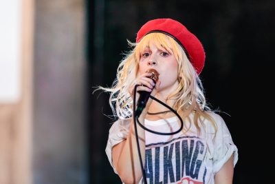 Hayley Williams looking my way, sporting a red hat and wild eyes. Photo: Lmsorenson.net