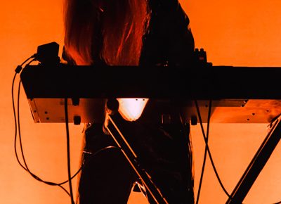 Front woman, Victoria Legrand, performing center stage.