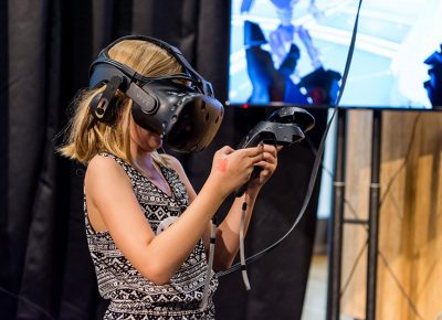 Young girl experiences Virtual Reality.