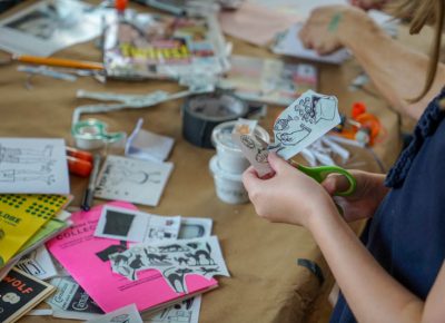 Cutting out images for the zine.