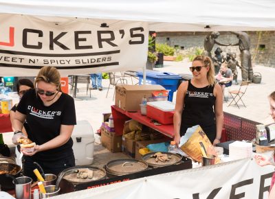 Cluckers staff cooking up some amazing food near the KRCL stage. Photo: Lmsorenson.net