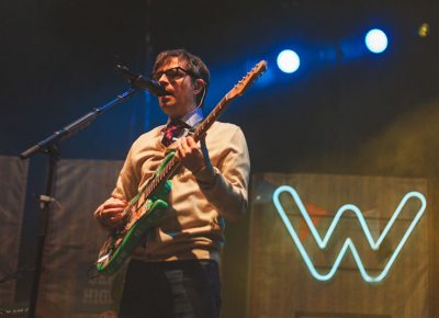 Rivers Cuomo is always dressed to the nines while performing with Weezer.