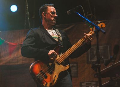 Scott Shriner gives that bass face while performing Buddy Holly.