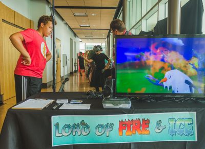 A Craft Lake City DIY Festival visitor tries his hand at the Lord of Fire & Ice VR game.